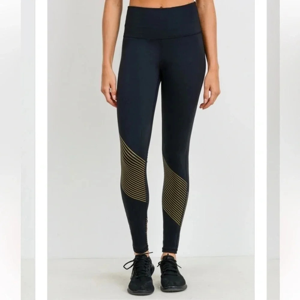 Mono b black leggings with gold accent stripes. Size M